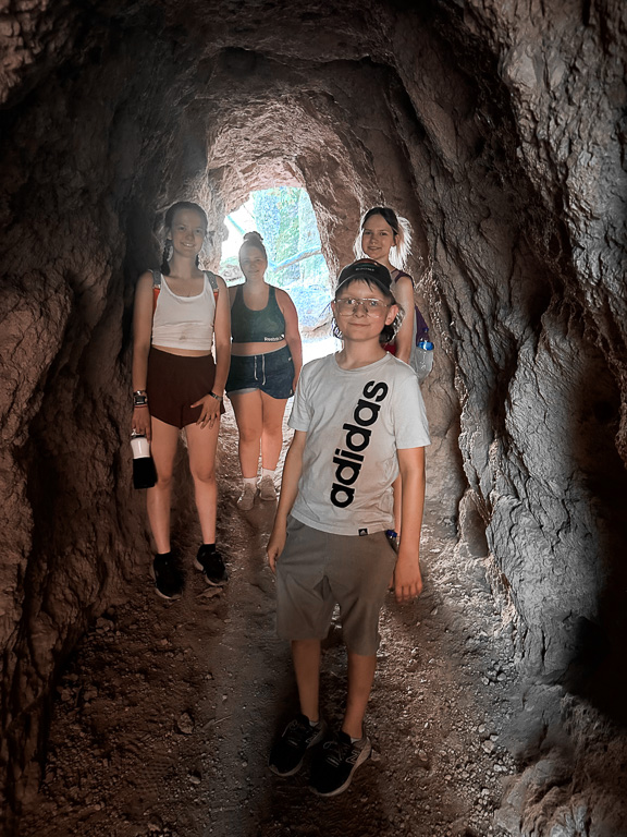 Kids in the tunnel - Moses Spring Trail to Bear Gulch Caves to Rim Trail